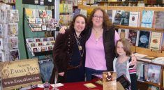 Emmaline signing books for her friend Ramona at the book signing at Orca Books Cooperative in Olympia Washington.