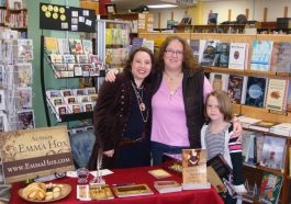 Emmaline signing books for her friend Ramona at the book signing at Orca Books Cooperative in Olympia Washington.