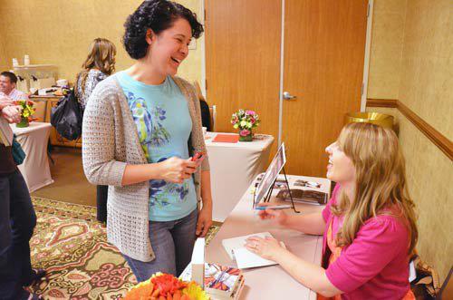Author Michelle Davidson Argyle signing books at the Got Stories Conference in Salt Lake City, Utah.