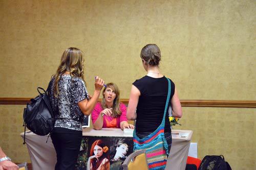 Author Michelle Davidson argyle signing books at the Got Stories Conference in Salt Lake City, Utah.