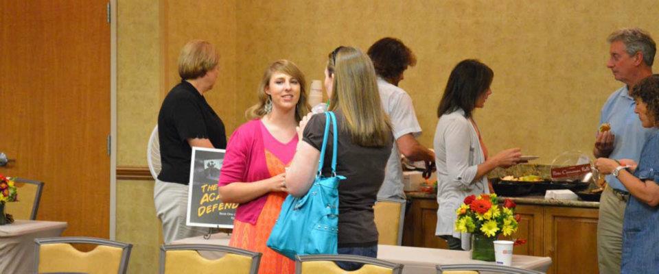 Author Michelle Davidson Argyle speaking to an aspiring author at the Got Stories Conference in Salt Lake City, Utah, in June 2012.