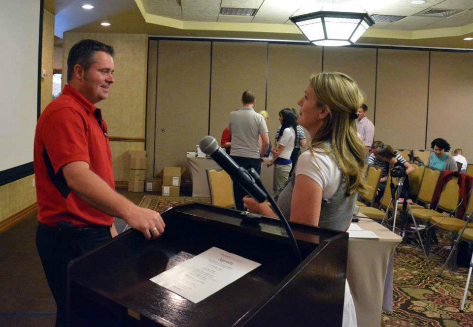 Rhett Hoffmeister talking to a participant at the Got Stories Conference in Salt Lake City, Utah, in June 2012.