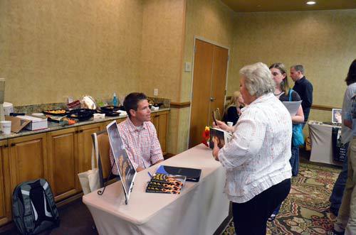 T. J. Robinson signing his book The Academy Defenders at the Got Stories conference in Salt Lake City, Utah.