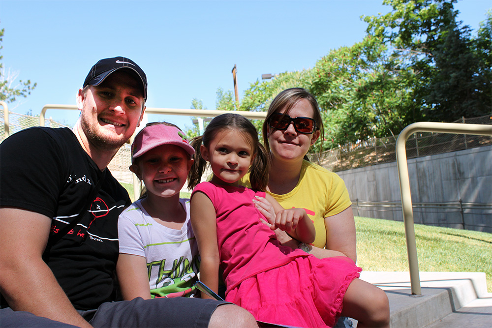 Ryan and Liz Vance with their daughters waiting for The World of Flight Bird Show at Hogle Zoo.