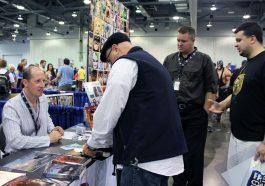 Rhett and two readers signing books with author Douglas Brown at the 2012 Columbus, Ohio Comic Con