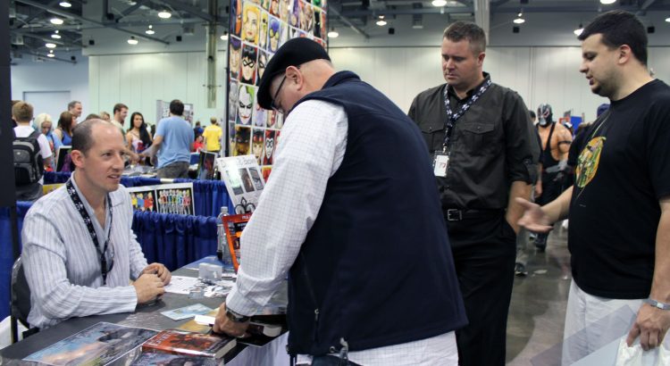 Rhett and two readers signing books with author Douglas Brown at the 2012 Columbus, Ohio Comic Con