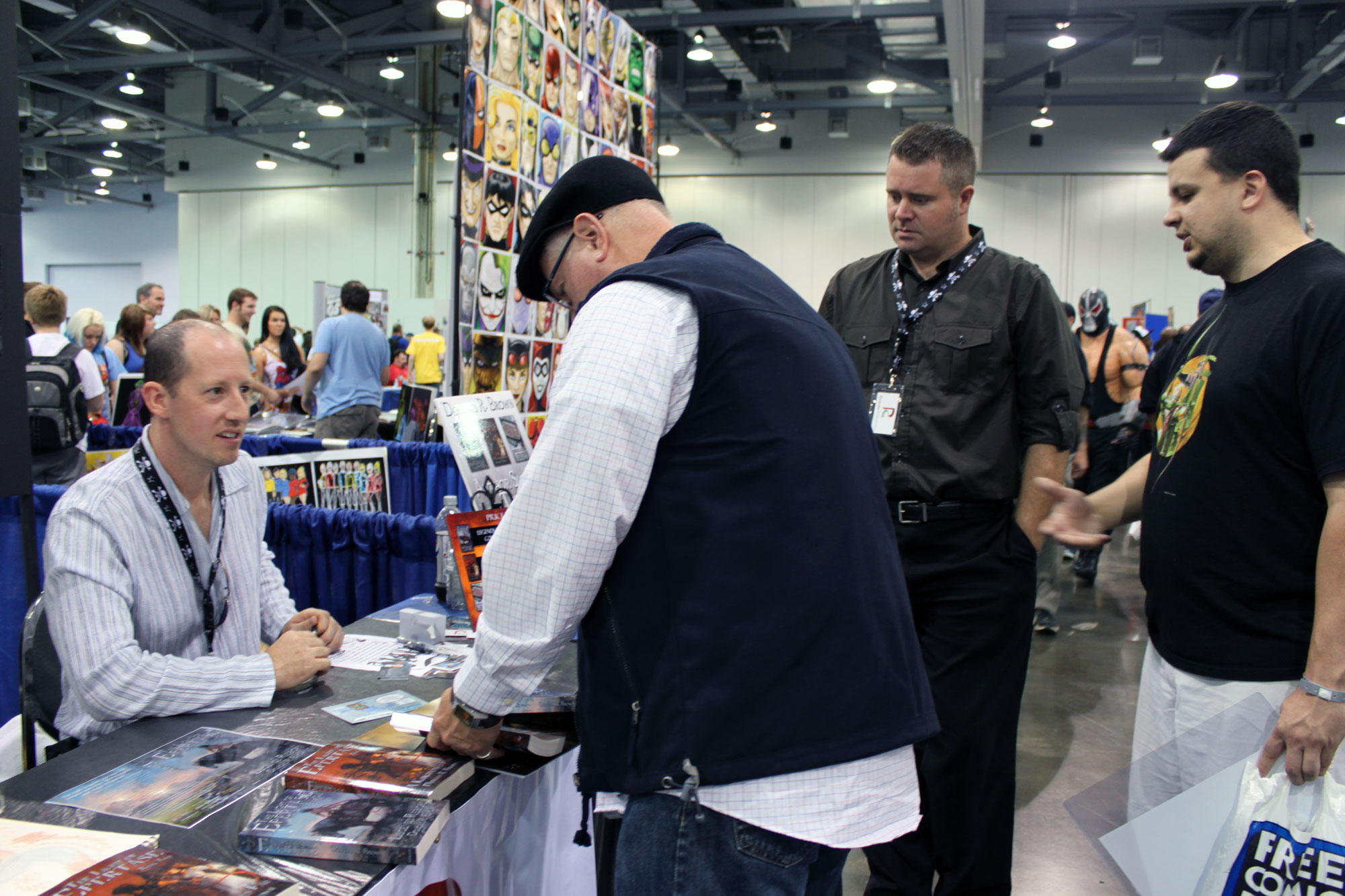Explore the Imagination of Author Douglas Brown at Wizard World Comic-Con Rhett and two readers signing books with author Douglas Brown at the 2012 Columbus, Ohio Comic Con