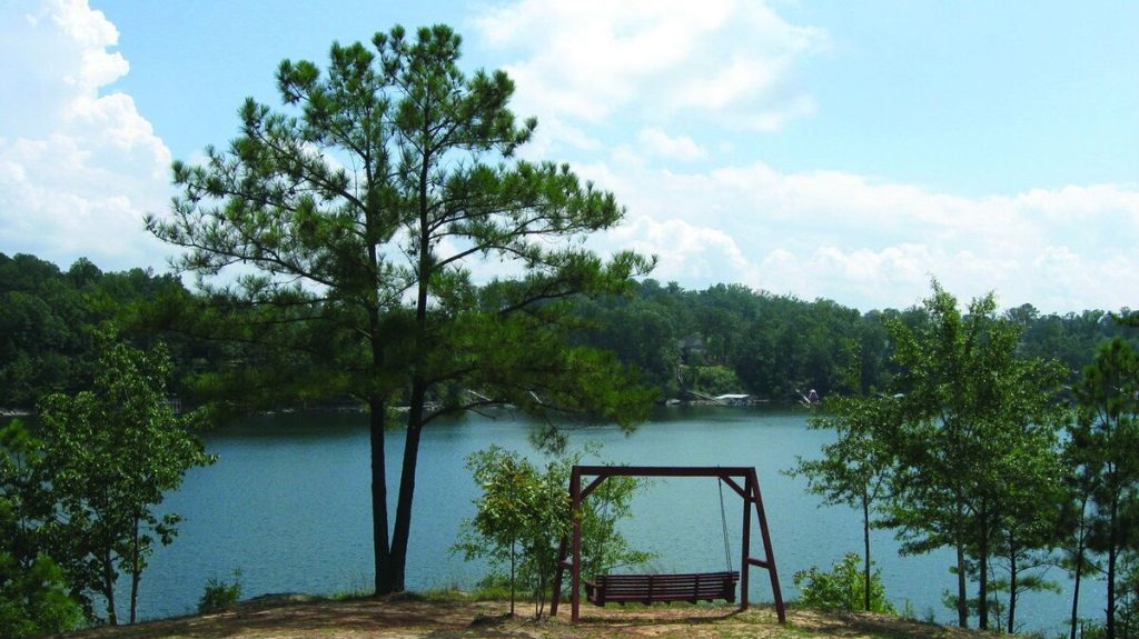 The swing overlooking the lake at Hidden Cove Thousand Trails RV Resort in Arley, Alabama.