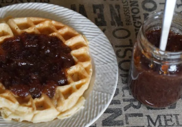 An image of a thick layer of delicious Apple Butter spread on a waffle.