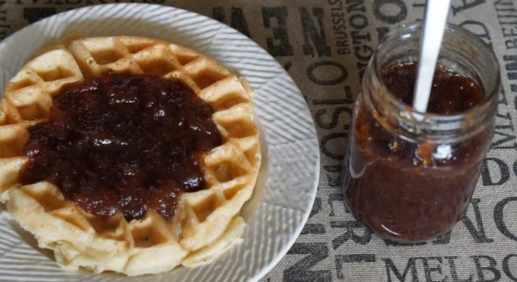 An image of a thick layer of delicious Apple Butter spread on a waffle.