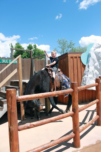 ARH riding a bronc at Wall Drug in South Dakota.