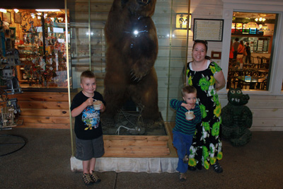 Emmaline and the boys posing with the bear at Wall Drug in South Dakota.