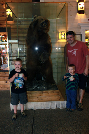 Rhett and the boys posing with the bear at Wall Drug in South Dakota.