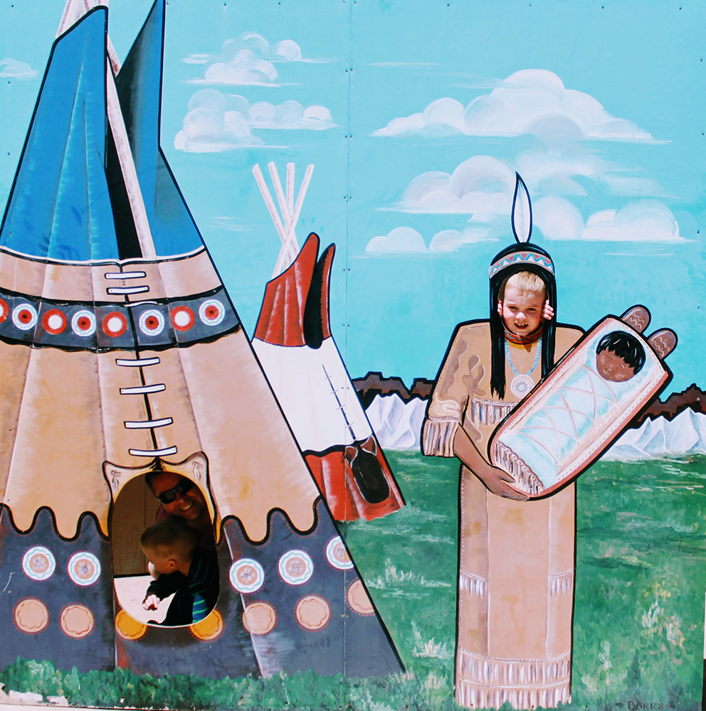 Rhett and the boys posing in the Indian Tee-Pee at Wall Drug in South Dakota.