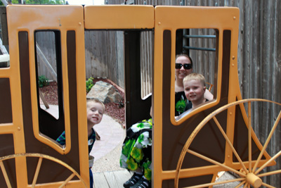 Emmaline with ARH and DEH in the stagecoach at Wall Drug in South Dakota.